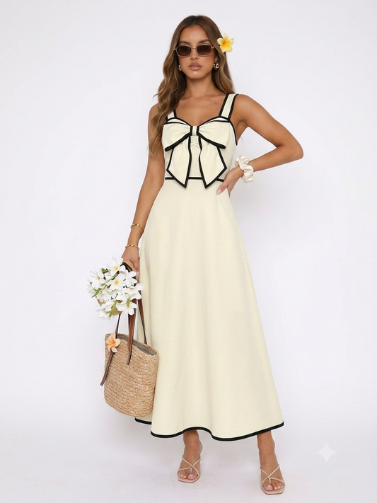 Robe longue beige à bretelles avec grand nœud noir contrasté au buste
